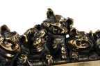 Bronze piglets sculpture — side view