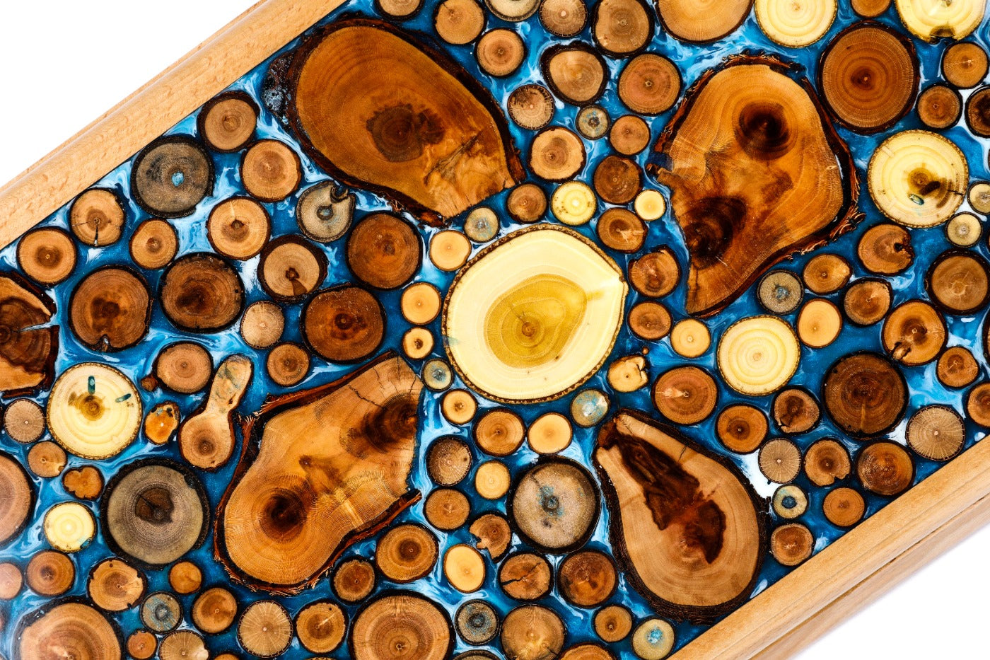 An angled view of the Hrachya Ohanyan board highlighting the glossy finish and the natural growth rings of the wood.