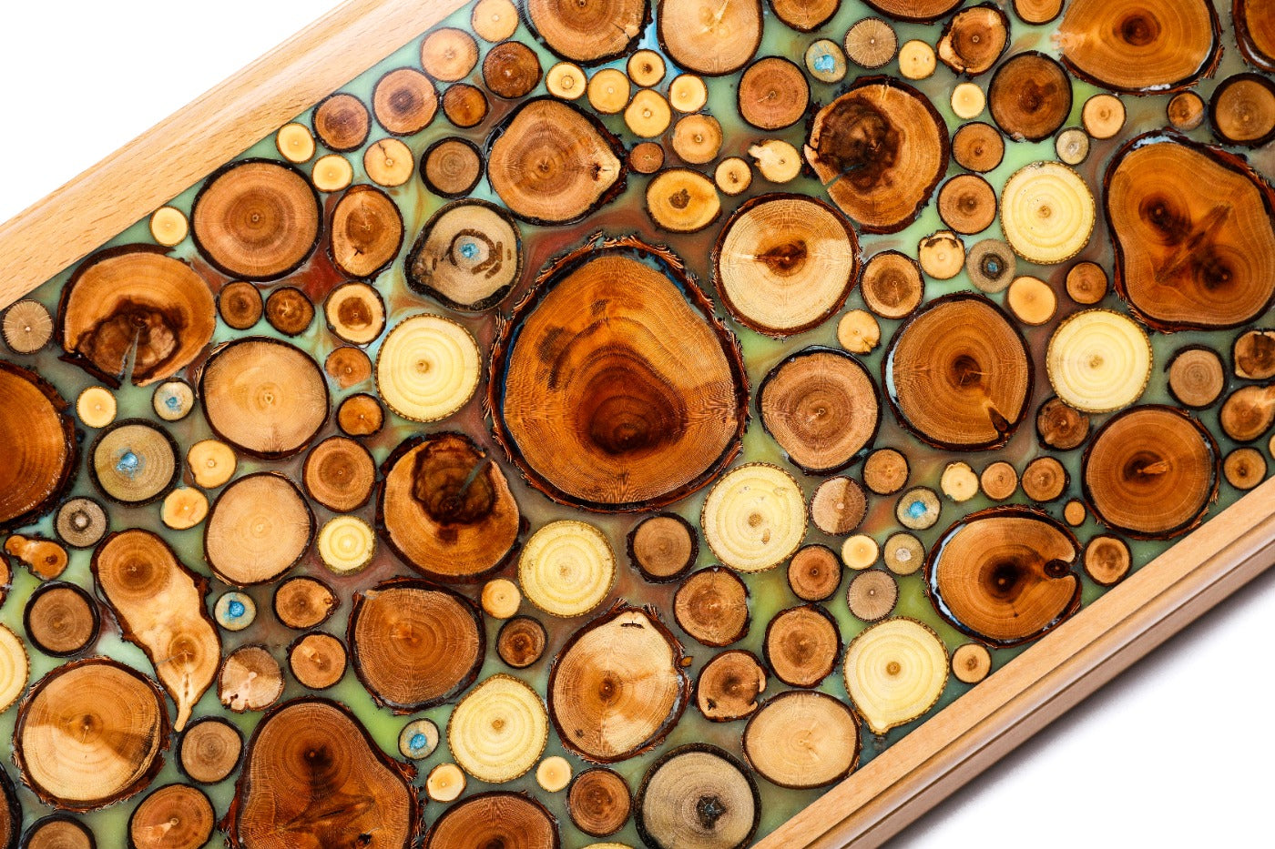 Close-up of the translucent turquoise resin and natural wood grain on the Hrachya Ohanyan board.