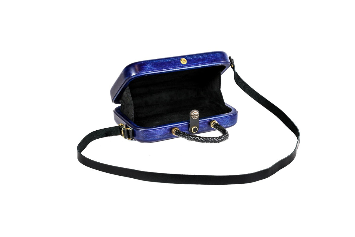 Sapphire blue wooden bag with leather strap — side view