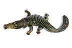 Crocodile sculpture in carved wood — side view