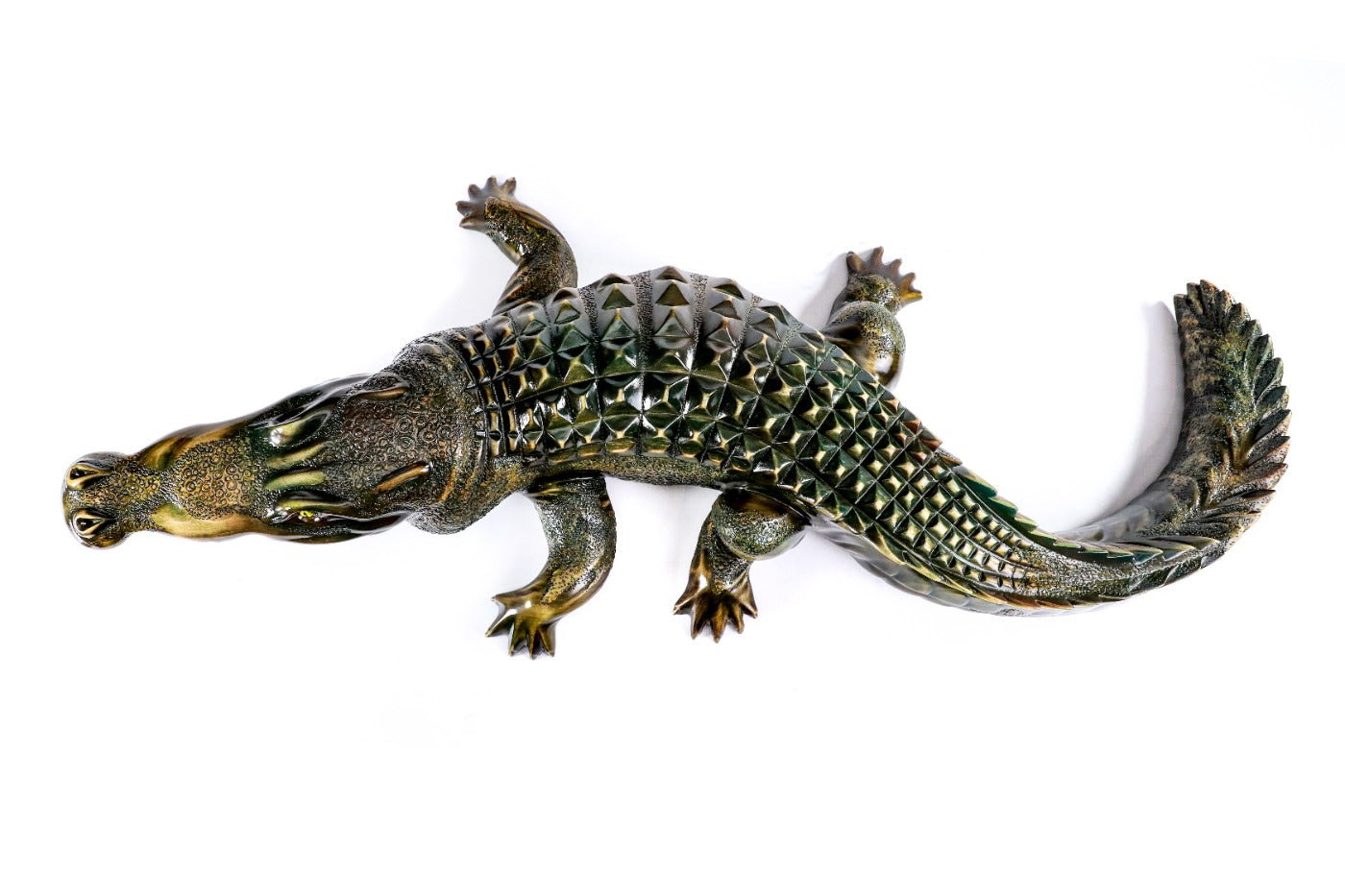 Crocodile sculpture in carved wood — side view