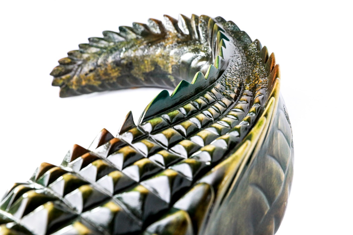 Hand-carved crocodile sculpture — tail detail