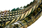 Hand-carved crocodile sculpture — display view