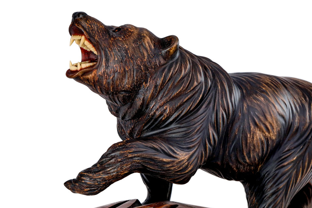 Bear sculpture in carved walnut wood — side view