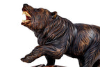 Bear sculpture in carved walnut wood — side view