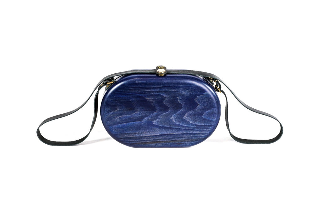Oval wooden handbag in navy blue — detail view