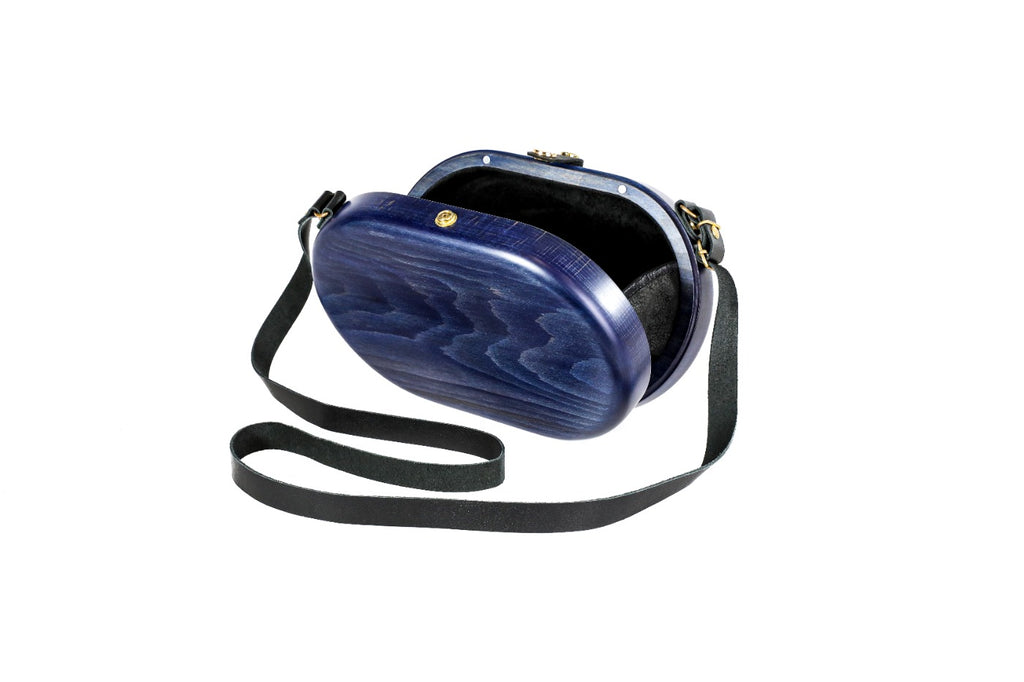 Handmade wooden handbag — wave grain close-up