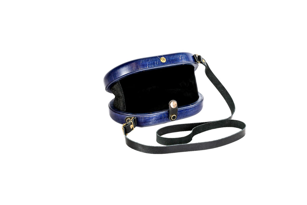 Oval wooden bag in navy blue — angle view