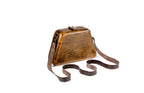 Brown wooden bag with leather strap — side view