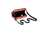 Brick red wooden bag with leather strap — side view