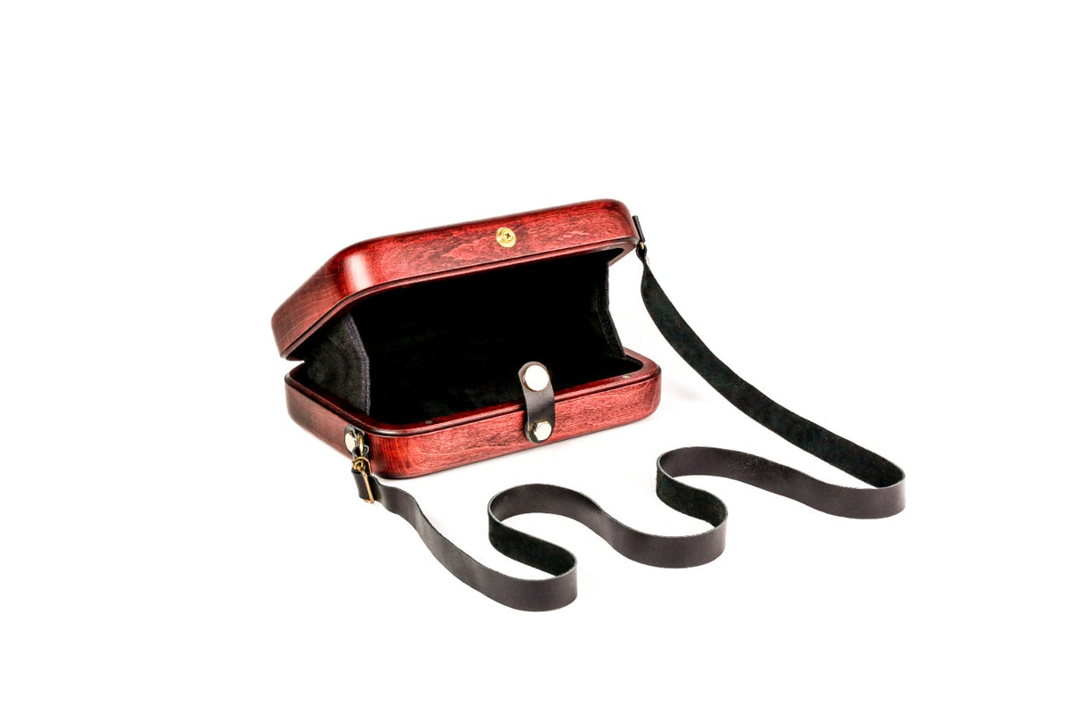 Brick red wooden bag with leather strap — side view