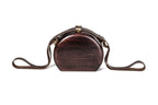 Round wooden handbag in espresso brown — detail view