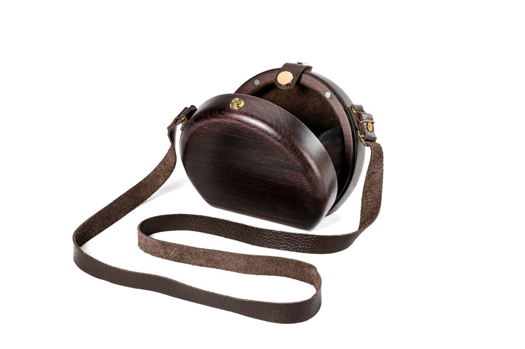 Round wooden bag in espresso brown — angle view