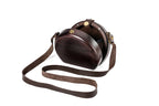 Round wooden bag in espresso brown — angle view
