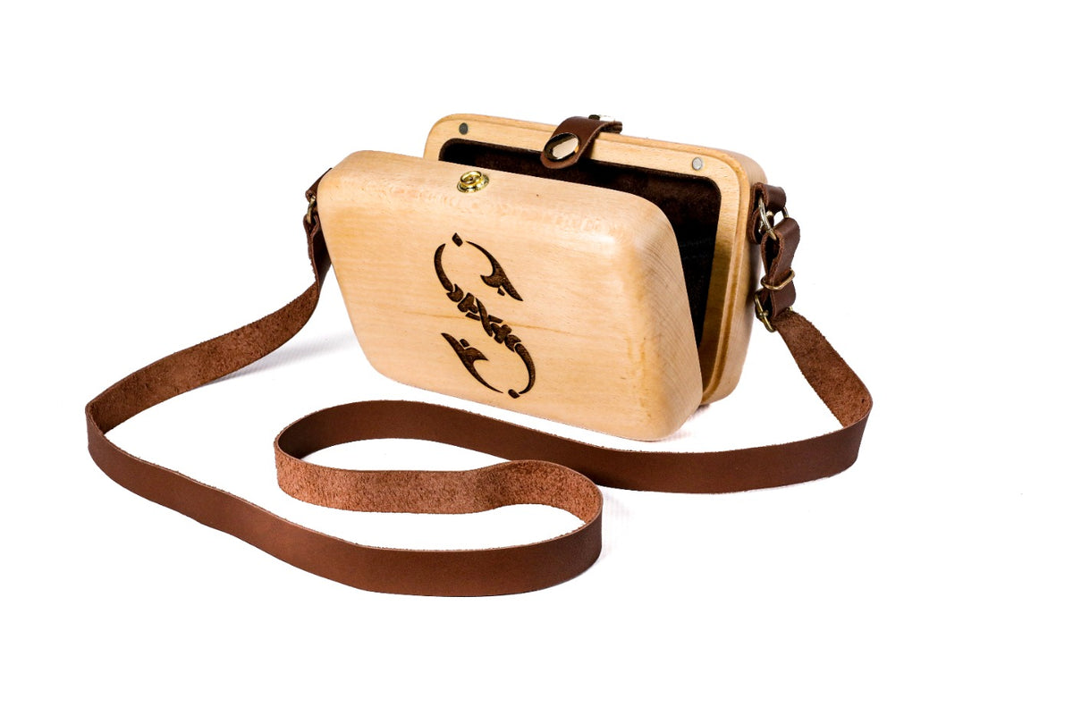 Handmade wooden handbag — engraved ornament close-up
