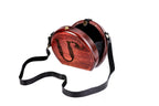 Round wooden handbag with engraved ornament — detail view