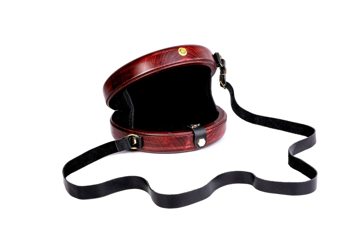 Engraved wooden bag with leather strap — side view