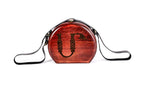 Handmade wooden handbag — engraved ornament close-up