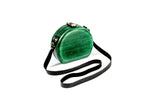 Round wooden handbag in emerald green — detail view
