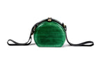 Round wooden bag in emerald green — angle view