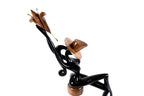 Figurative wooden sculpture of a sitting model — back view