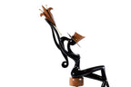 Sitting model wooden sculpture — profile view