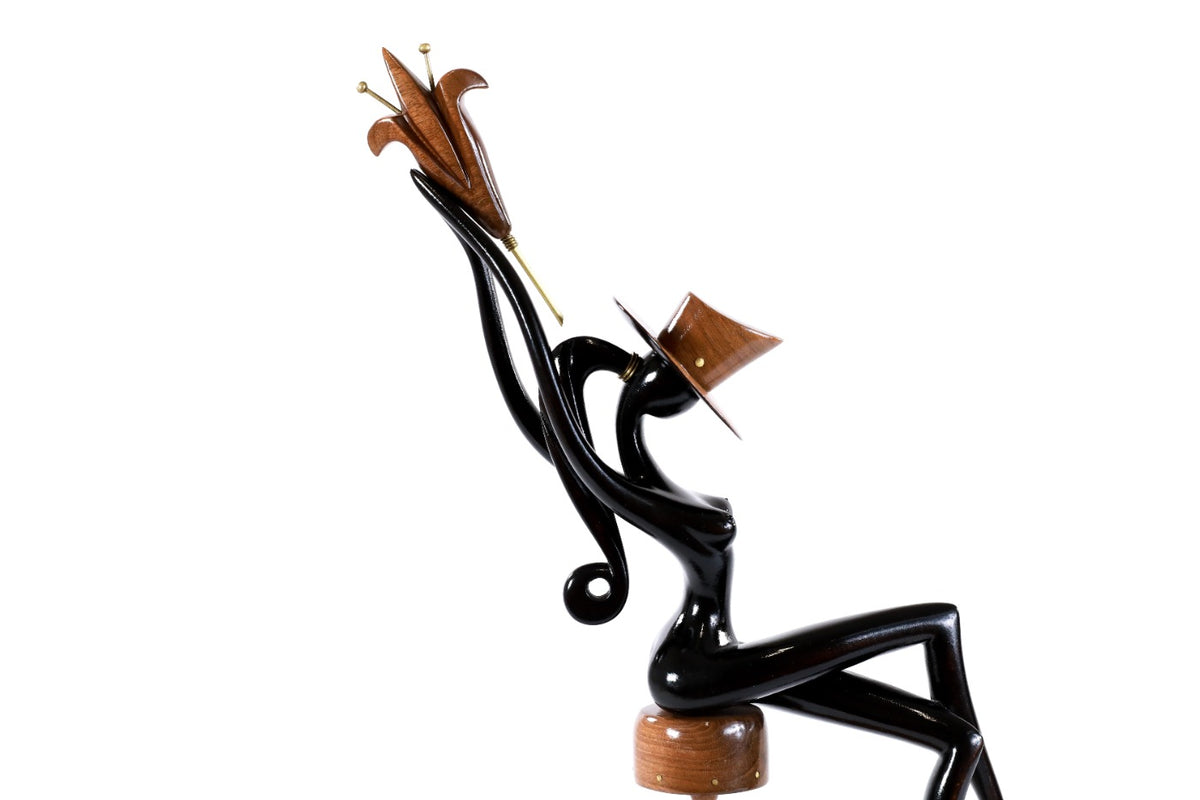 Sitting model wooden sculpture — profile view