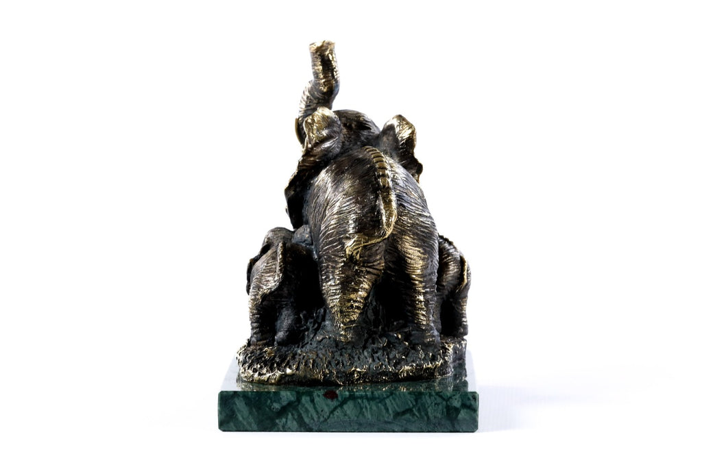 Handmade bronze elephant figurine with calves — close-up