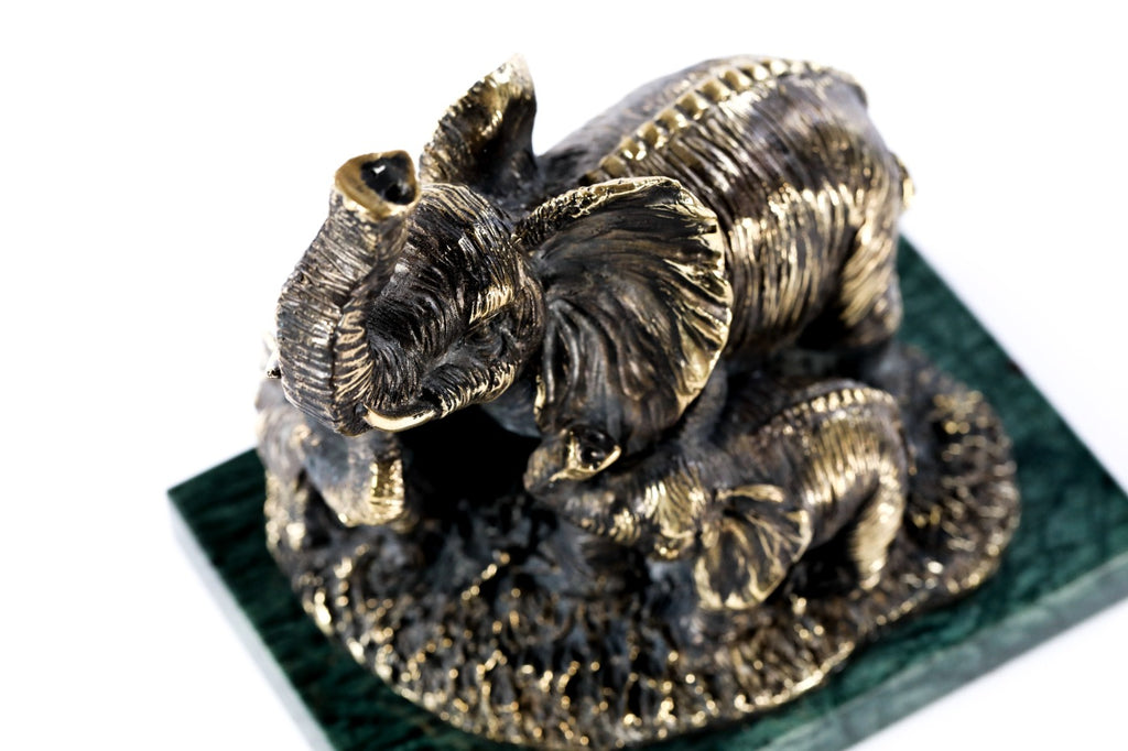 Bronze elephant with calves sculpture — back view