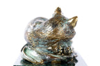 Handmade bronze cat figurine — close-up