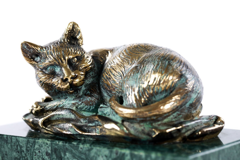 Bronze cat sculpture — detail view