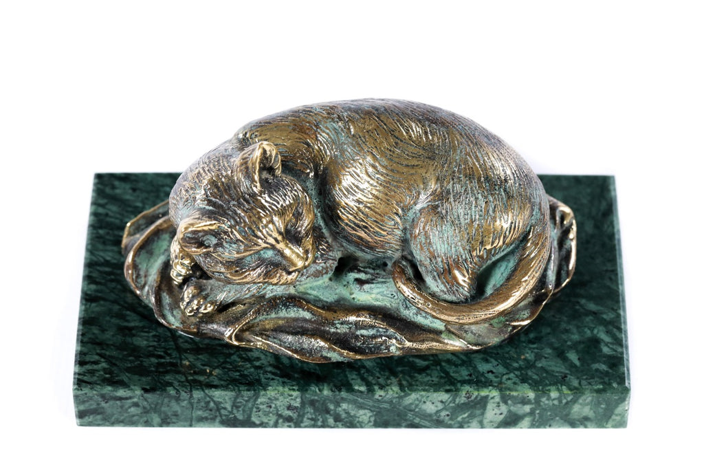 Bronze cat sculpture — back view