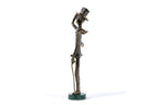 Bronze Boy with a Cane sculpture — side view