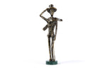 Handmade bronze boy figurine — close-up