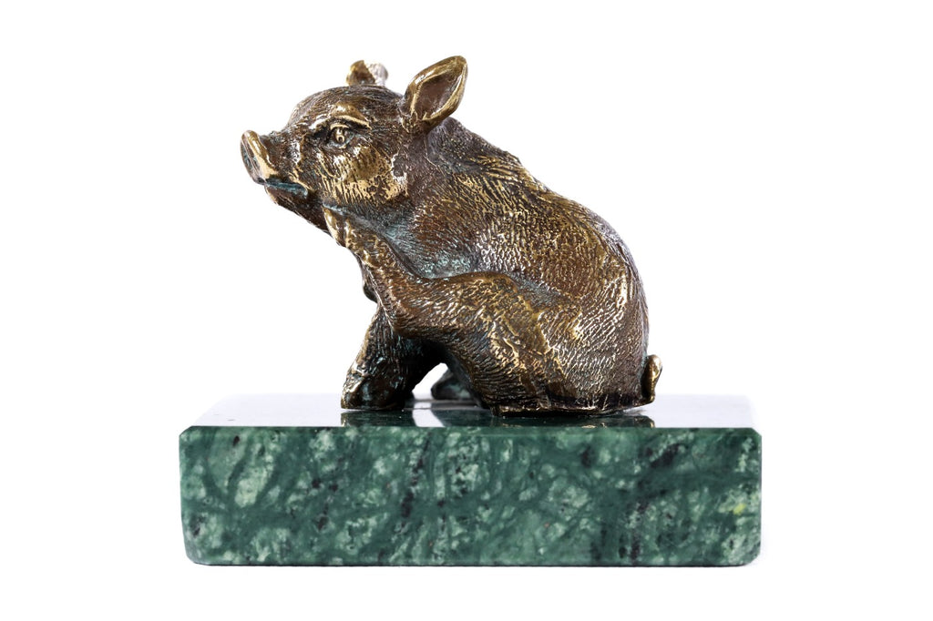 Bronze piglet sculpture — back view