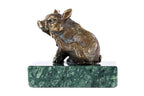 Bronze piglet sculpture — back view