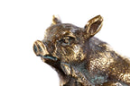 Bronze piglet sculpture — side view