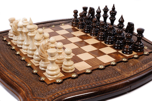 Handcrafted wooden chess board with sculpted curved edges, brass studs and textured border — 2-in-1 set