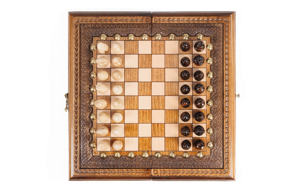 Top-down view of the travel chess set with all 32 pieces in starting position
