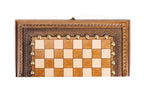 Front view of the closed portable chess and backgammon board with carved textured border