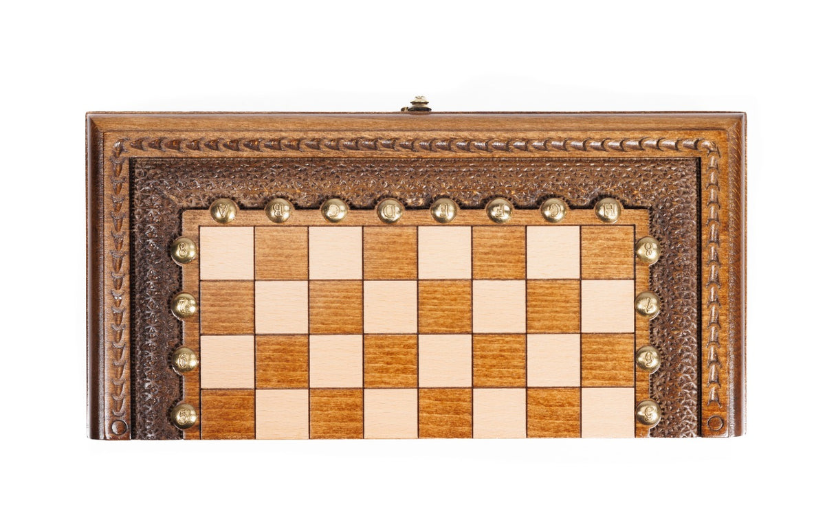 Front view of the closed portable chess and backgammon board with carved textured border