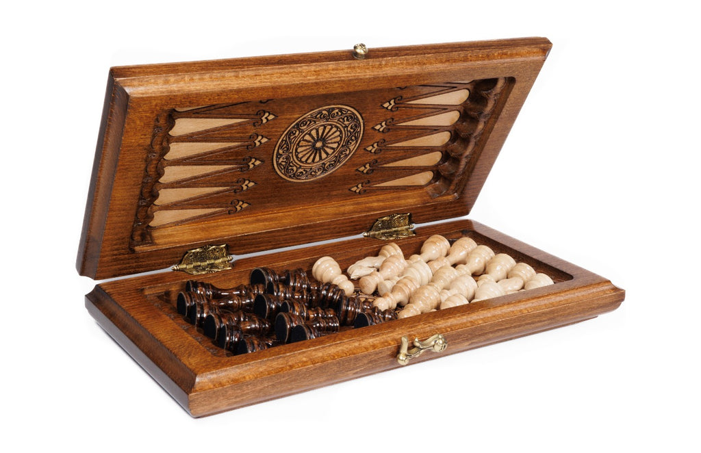 Travel chess and backgammon set half open, chess pieces stored inside on the backgammon field