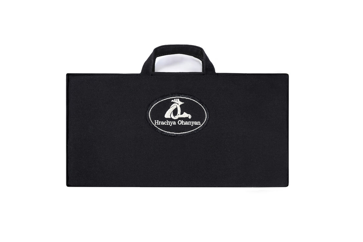 Front of the Hrachya Ohanyan carrying bag with handle, included with the travel chess set