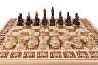 Handmade chess and backgammon set - close-up of hand-carved chess pieces