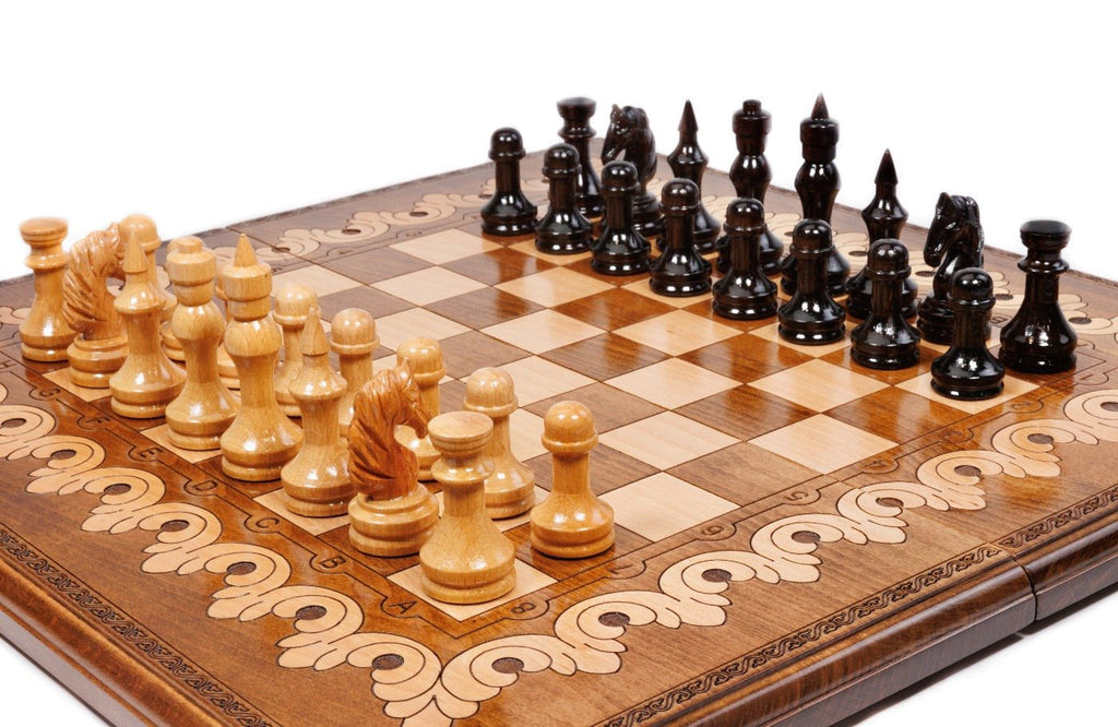 Wooden chess board featuring decorative carved patterns and detailed craftsmanship