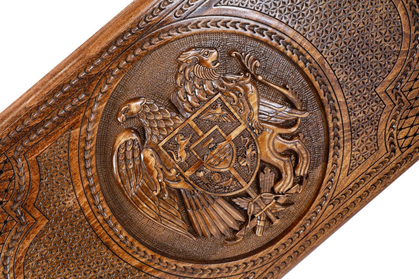 The interior view of the open Hrachya Ohanyan Armenian emblem set highlighting the smooth wood finish and professional pips.