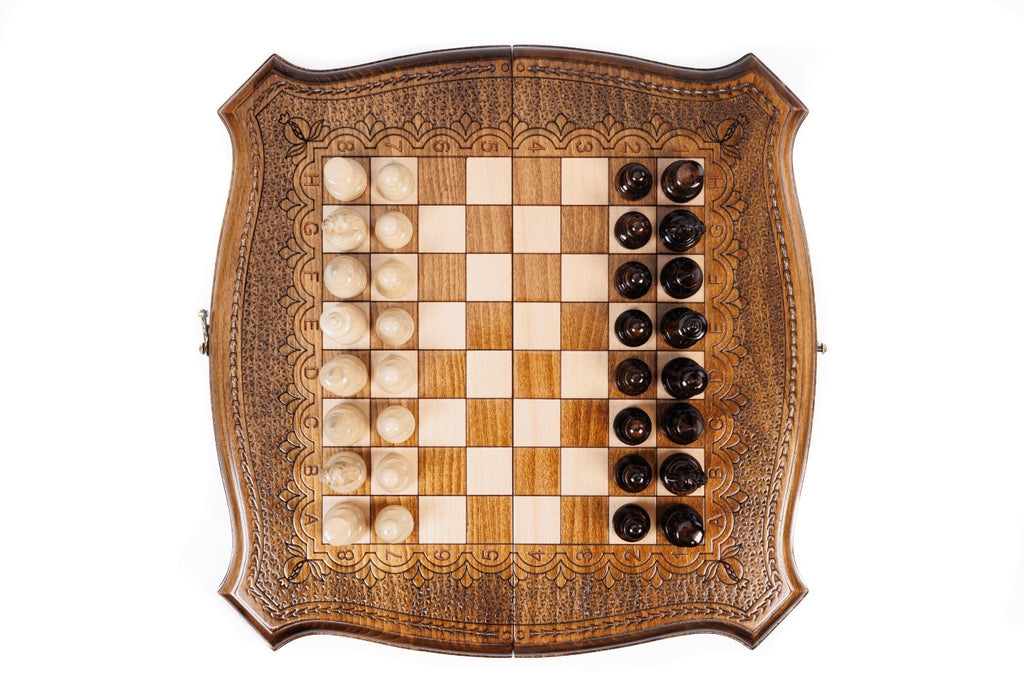 Top-down view of the contour outline chess set with all 32 pieces in starting position