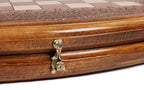 Cast-bronze clasp on the curved edge of the wooden chess and backgammon set