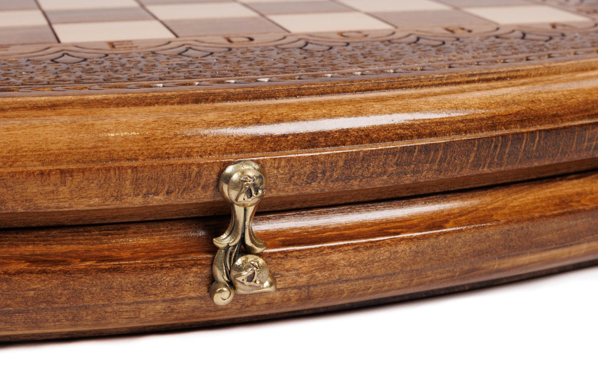 Cast-bronze clasp on the curved edge of the wooden chess and backgammon set